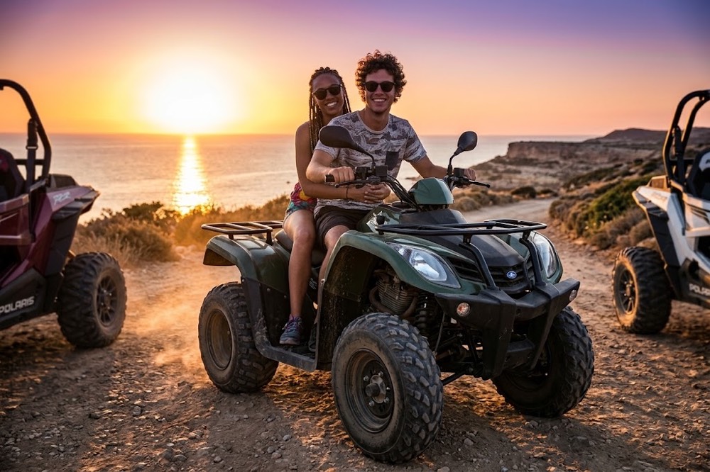 Green quad ATV with two riders leading a safari convoy at sunset on the Paphos coast