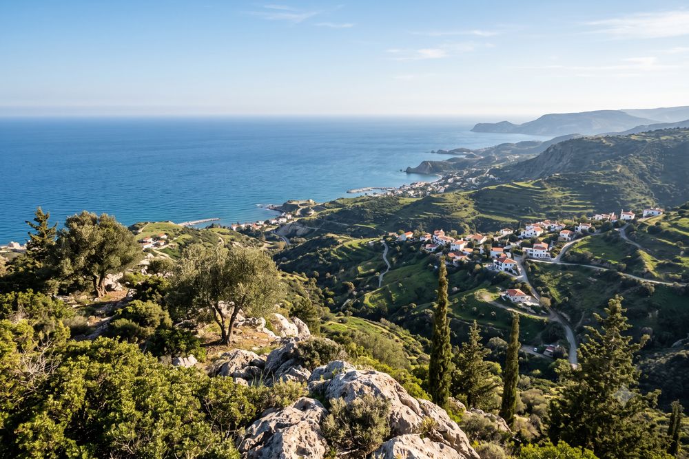 High hillside viewpoint looking out over green hills and the Mediterranean coastline in Cyprus